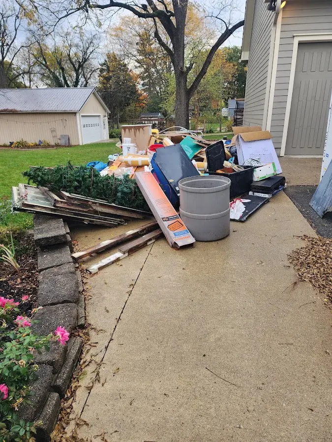 Dumpster being loaded with debris for Estate Cleanout Dumpster Rental in Parker